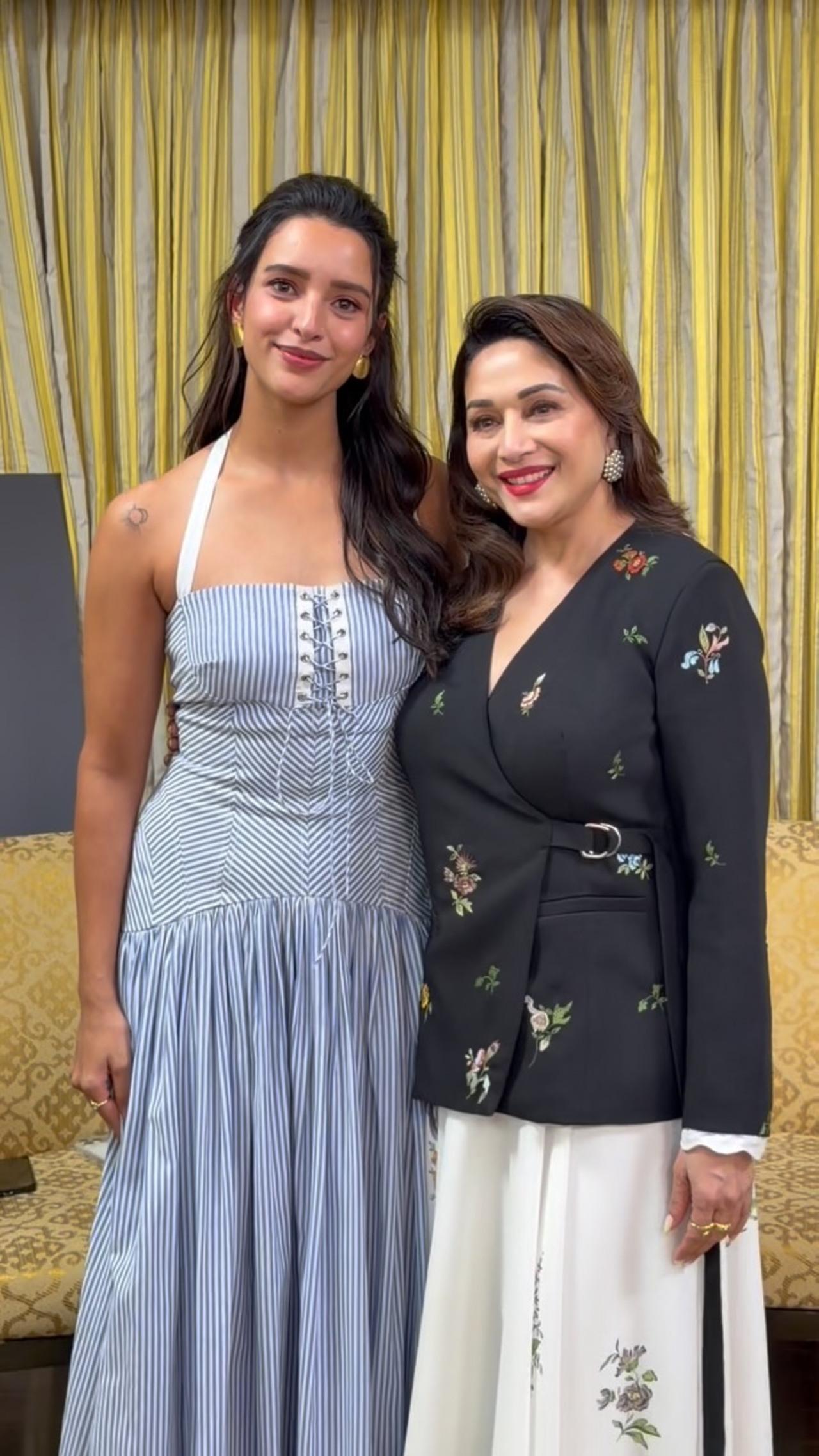Madhuri Dixit defines sharp sophistication in a chic Indo-western co-ord set, pairing a tailored black wrap jacket with a crisp white maxi skirt.